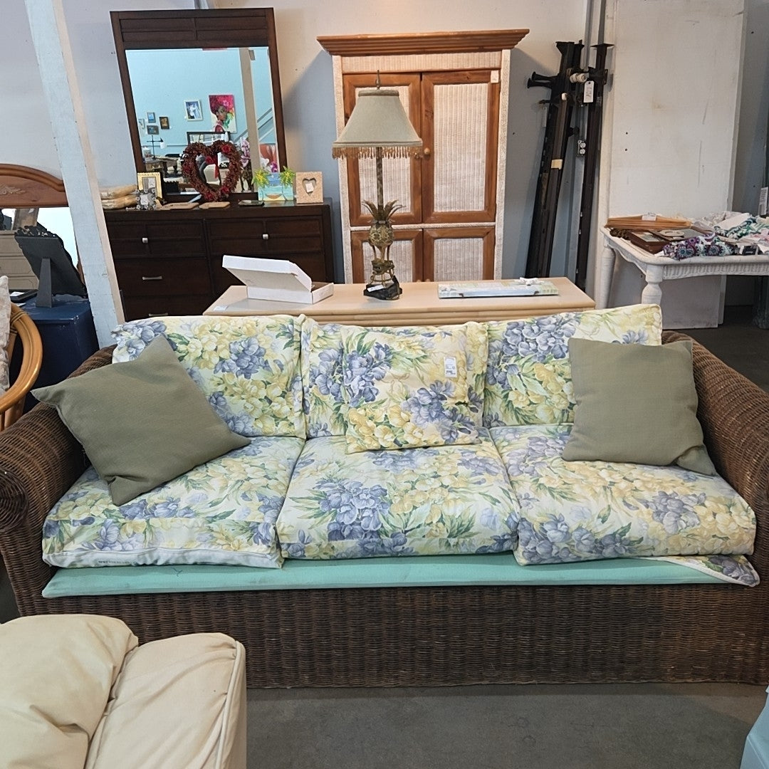 wicker/rattan sofa with pillows