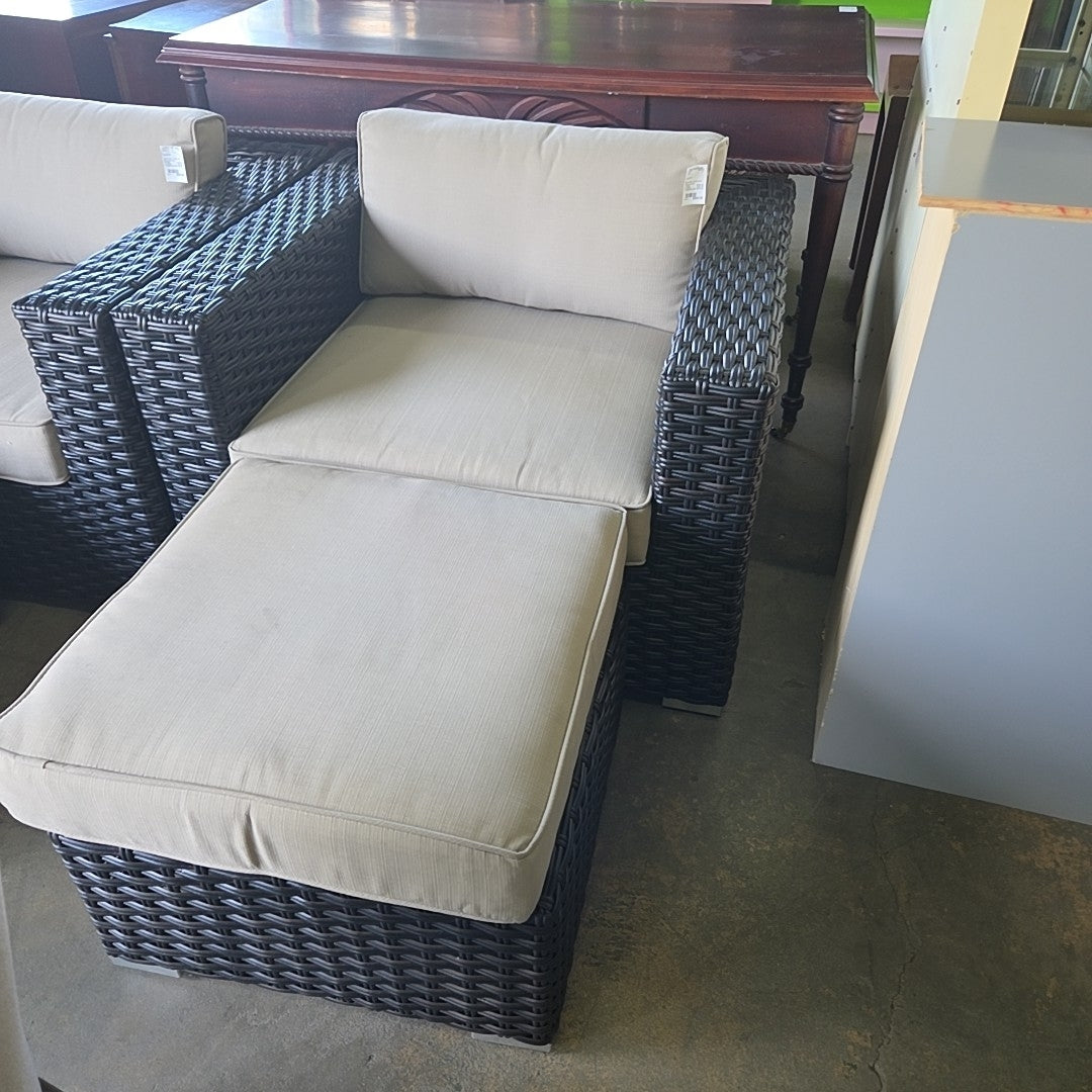 black wicker outdoor patio seat w/ ottoman