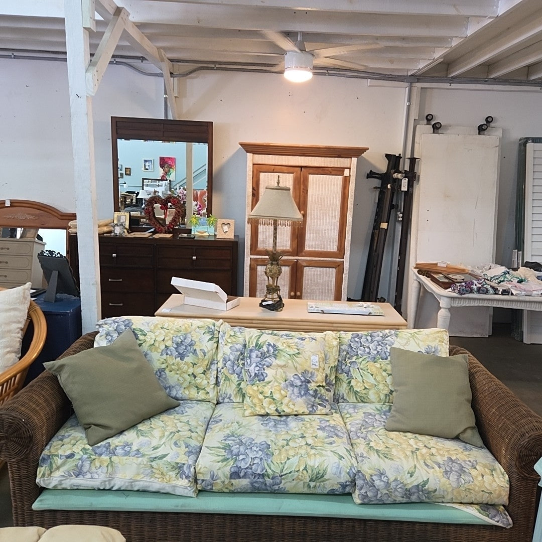wicker/rattan sofa with pillows